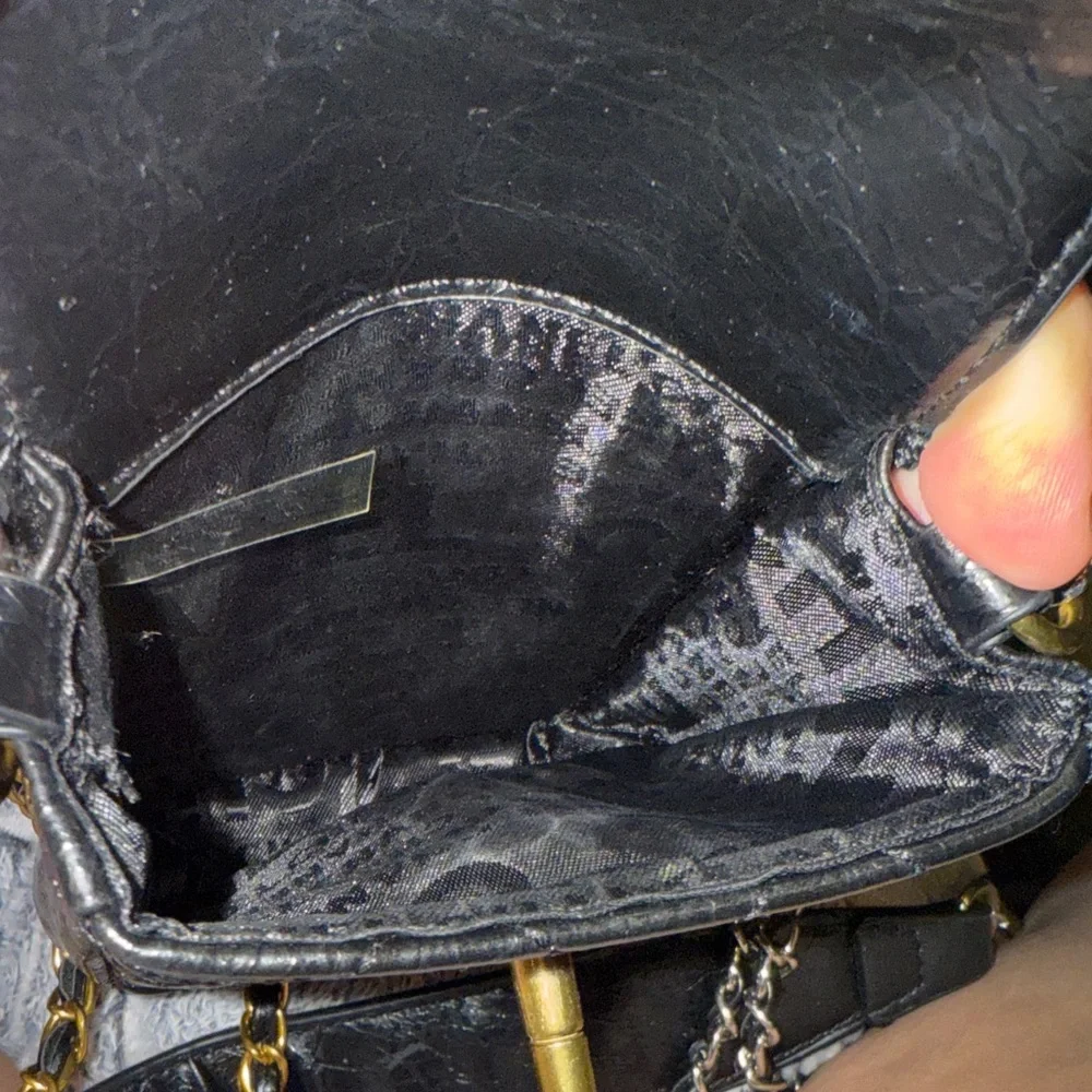 CHANEL Black Quilted Mini Bag with Gold Accents